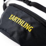 Black Earthling bag worn as crossbody
