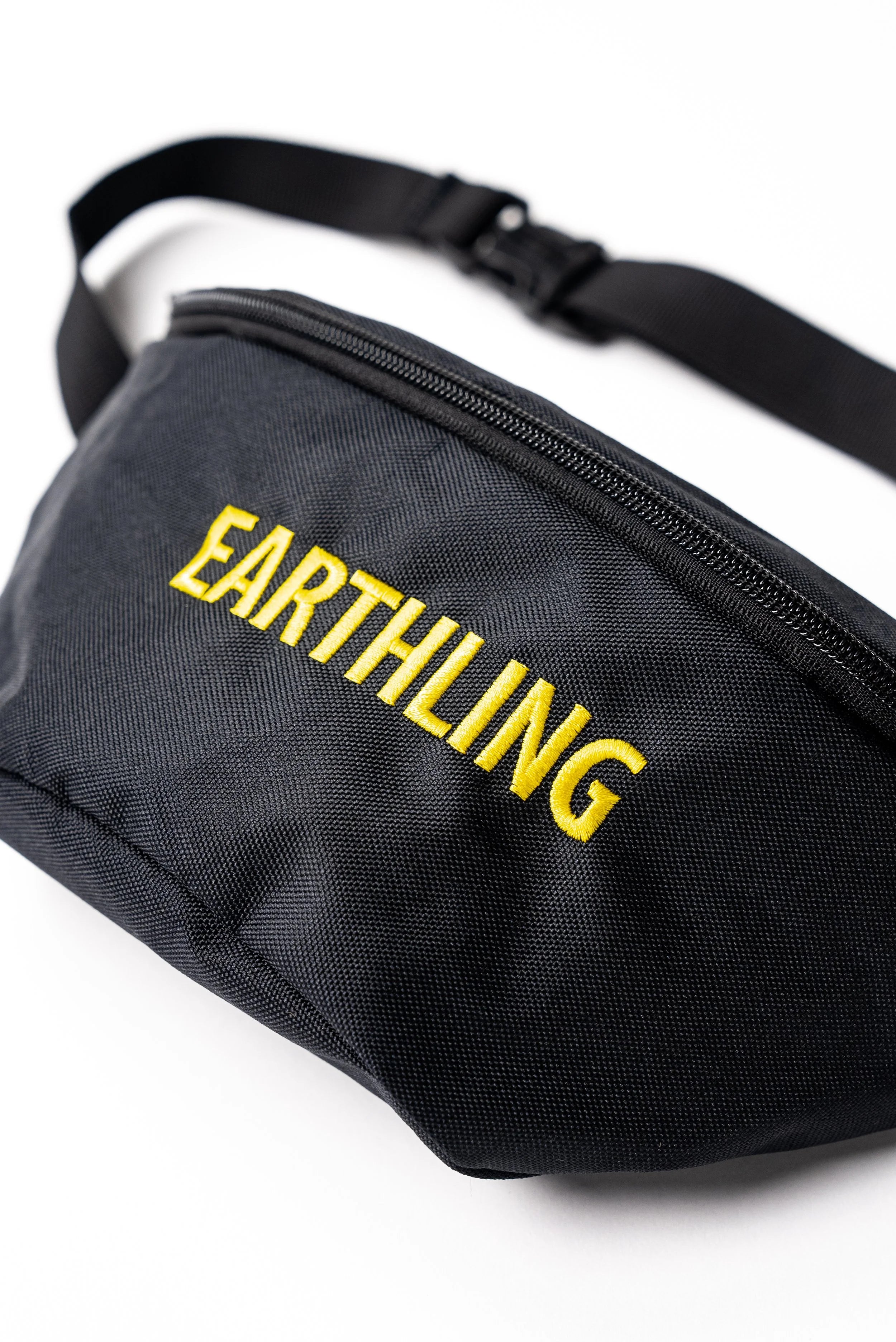Black Earthling bag worn as crossbody
