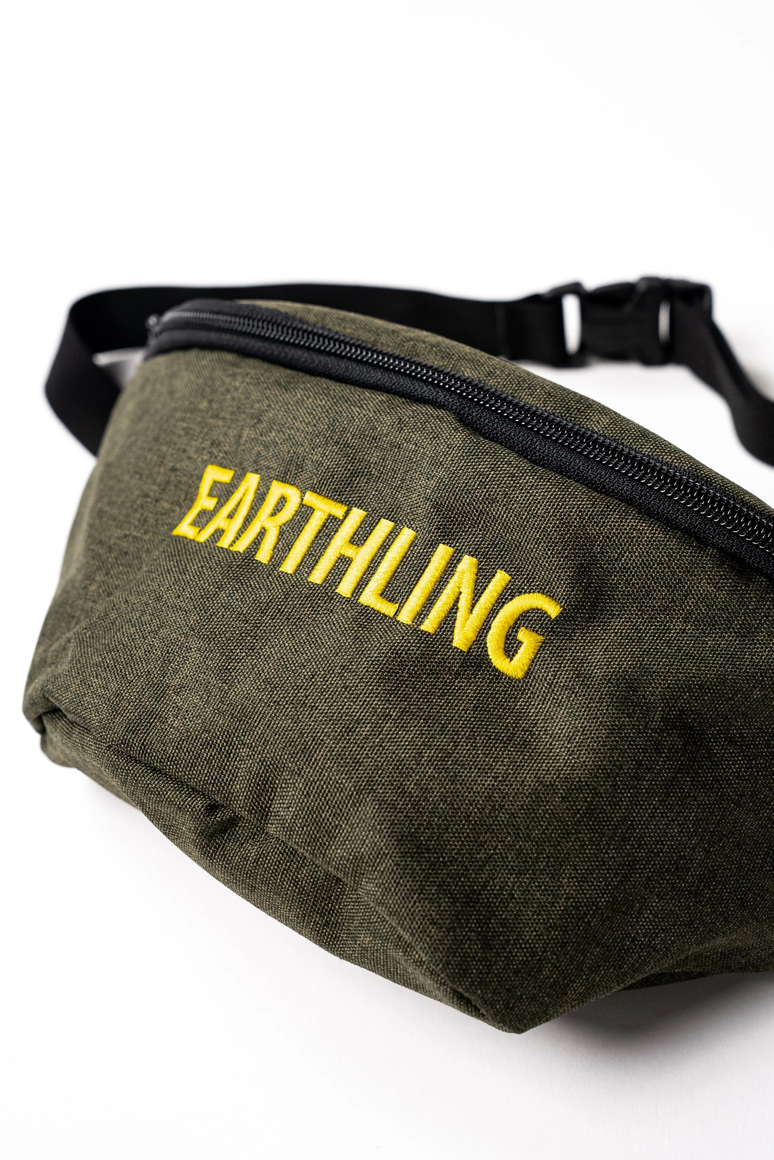 Olive green Earthling bag worn as crossbody