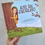 Kate the Earthling children's book held in hand