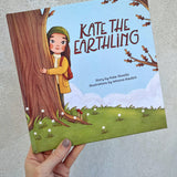 Kate the Earthling children's book held in hand