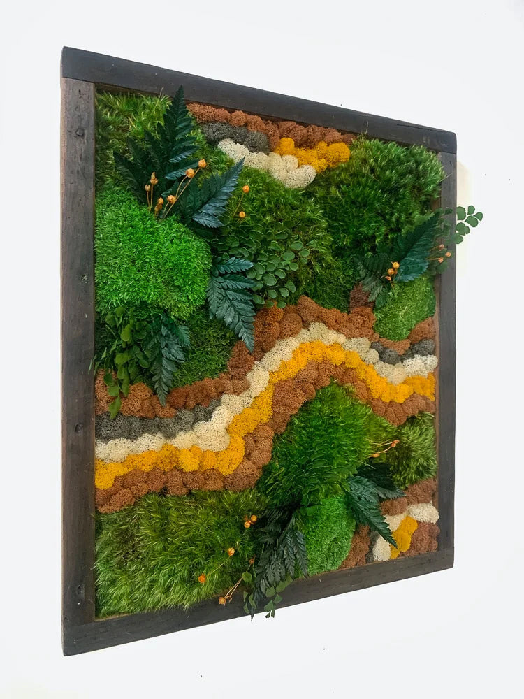 Preserved moss art with a winding band of ochre and cream moss through green moss and ferns